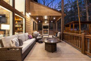 The back porch area oh a Hochatown cabin rental to relax on after checking out local activities.