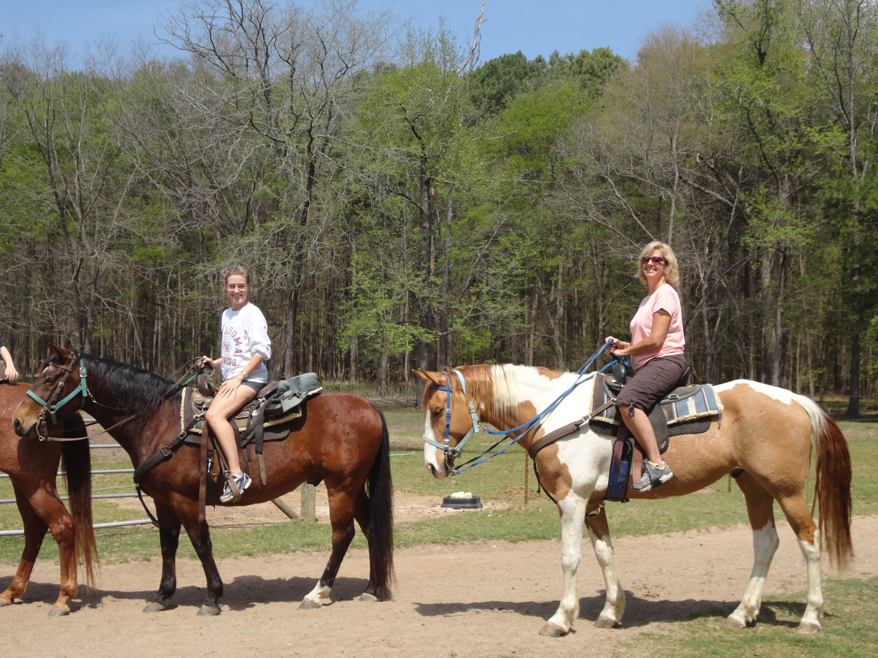 A group of people horseback riding, one of the best activities in Hochatown.